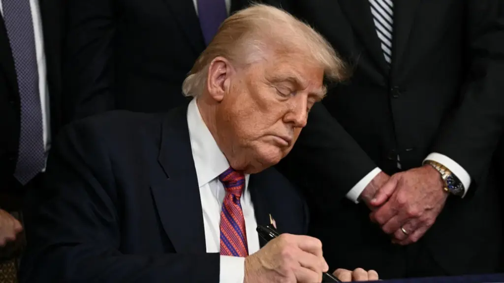 Cbsn fusion trump signs genius act first federal law regulating crypto thumbnail