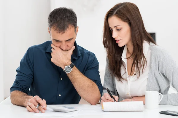 Depositphotos 39422933 stock photo couple calculating budget