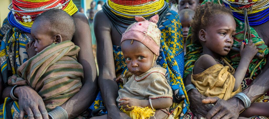 Wvc world hunger facts how to help children on laps hero