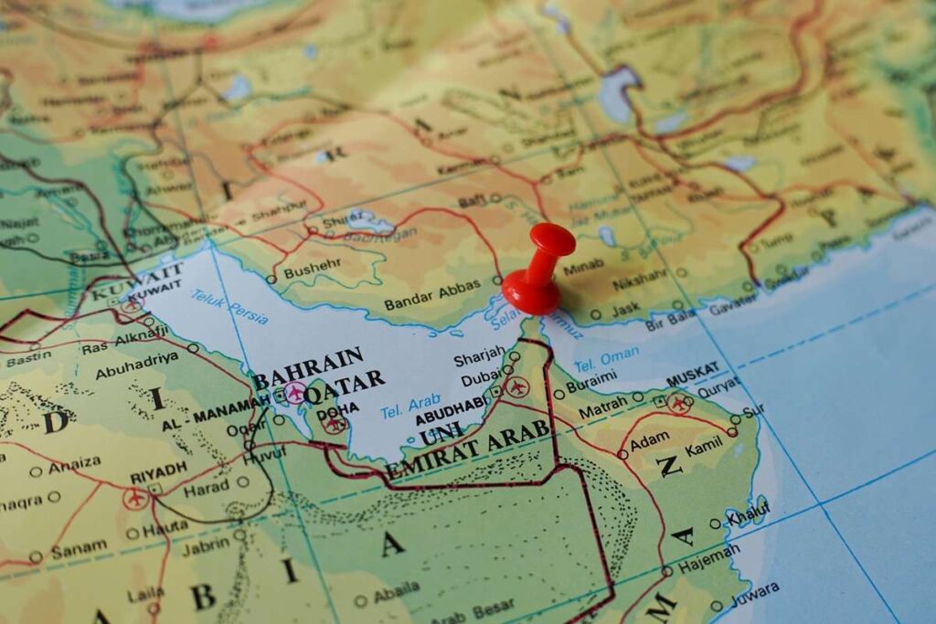 Red,Pushpin,Marking,The,Strait,Of,Hormuz,On,World,Map
